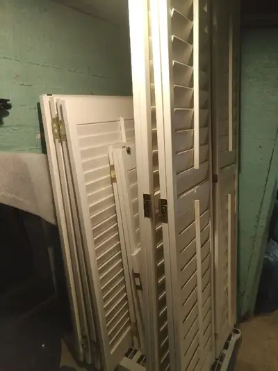 Quality wood shutters with hinges. Sizes (hxw inches): 52.5x29.25(1), 52.5x31(4), 41.5x23.75(3), 25....