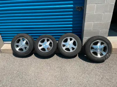 F9ZZ1007KA Used Ford Mustang 15 inch five lug aluminum wheels with rubber. Set of four. Mismatched t...