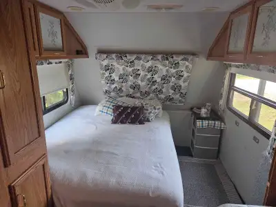 Lots of updates. Great, full size queen mattress. Great AC. Good tires. Will need some future repair...