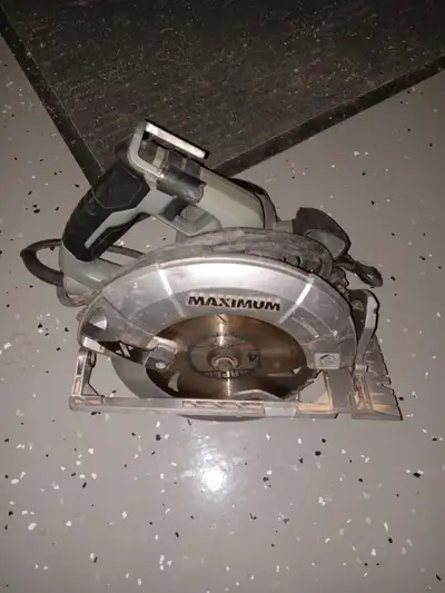 Good saw with built-in light and brake, located in Kenilworth porch pickup available