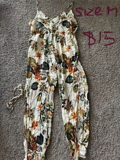 brand new romper. never worn. its way too large for me. it says size medium but would likely fit lar...