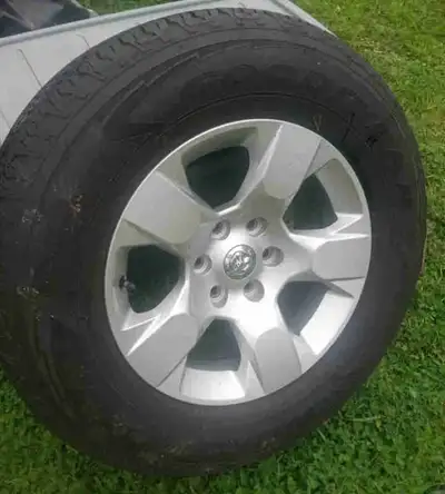 1 Brand new Dodge Rim and Tire, never mounted. 275/65/R18 If ad is up it is still available