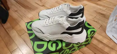 Low-top buffed nappa calfskin sneakers in white. · Perforated detailing at toe and sides · Lace-up c...