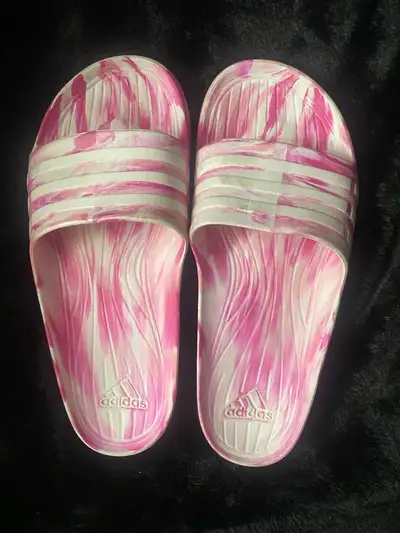 Selling a pair of Adidas Adilette Aqua slides in a rare pink and white marbled swirl pattern. These...