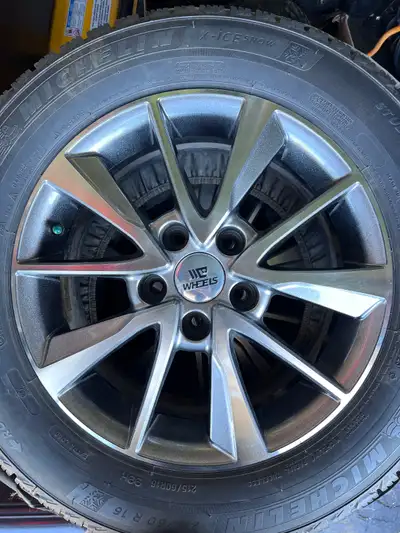 Michelin X-ICE Snow Tires 215/60R16 99H XL, on C Wheels rims (model CW081807). Tires and rims were u...