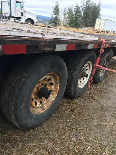 30’ with good solid deck and ramps 3 axles 7,000lb each New wirering, lights, bearings, brakes and d...
