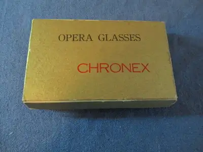 In their original box, these CHRONEX OPERA GLASSES are in good working order. Appx. 4.5" x 2.5", cle...