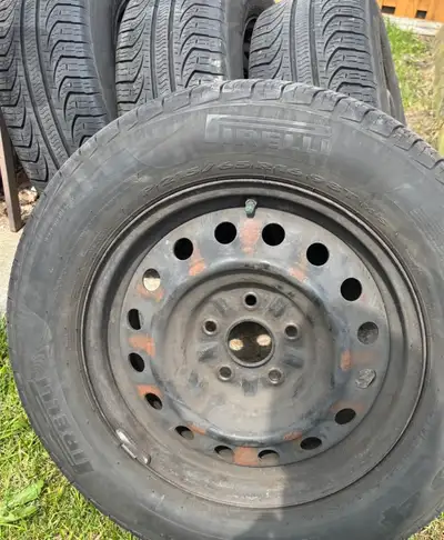 P215/65R16 all seasons Pirelli tires with OEM steel rims Used on Toyota Sienna. Like new. Less than...