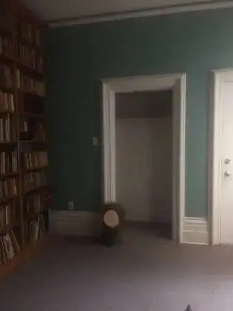A bright cozy private room, it is very large room with a bookcase and non-working fireplace. It come...