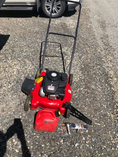 20” YardMachines gas mower. New power rake blade and replacement pieces. Jerrycan of gas and power r...