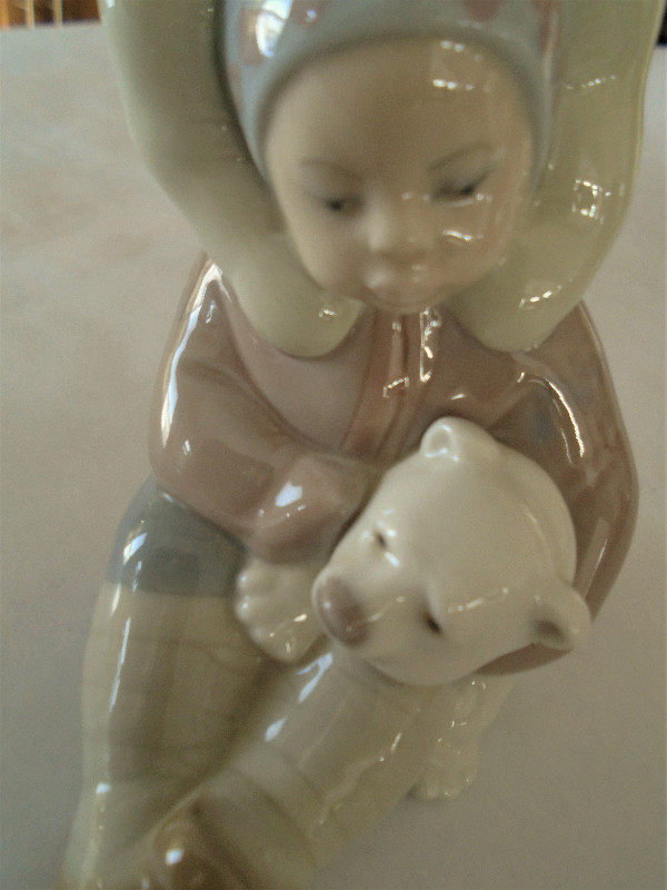 Lladro figure of Inuit girl with polar bear cub in Arts & Collectibles in Moose Jaw