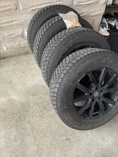 Bridgestone Blizzak snow tires on rims 225 /65R 17 102S Like new only 2 winters on them Sold the 202...