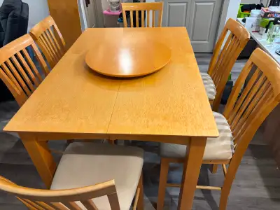 Bar table, 6 chairs, extender leaf and lazy Susan. Table is 36” in height , 54 x 54 with the leaf, 5...