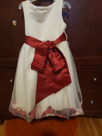 Flower girl dress with red colored petals