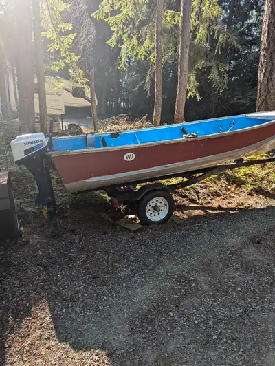 14 ft. Aluminum boat with a 9.9 Honda motor 4-stroke on a trailer