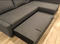 Ikea sectional couch with pull-out bed and storage compartment