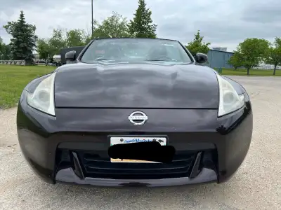 Turn heads this summer behind the wheel of this stunning 370Z Roadster! Powered by a 3.7L V6 engine...