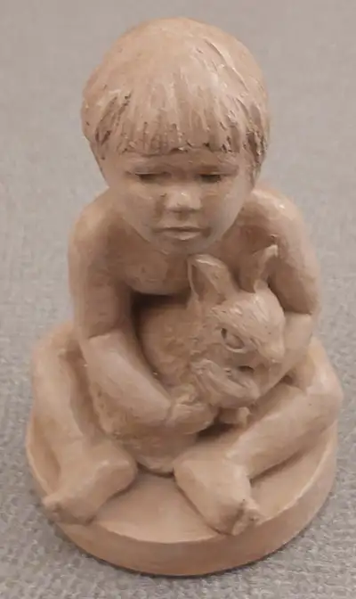 Statuette en céramique garçon tenant un lapin, View more