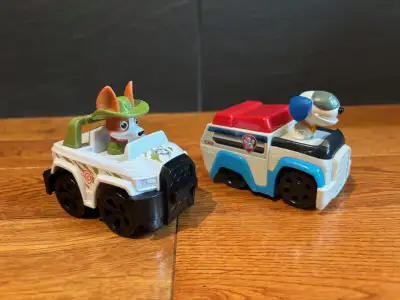 Paw Patrol Rescue Racers - Robodog and Tracker Jungle Pup Both are in almost new condition $15 for b...