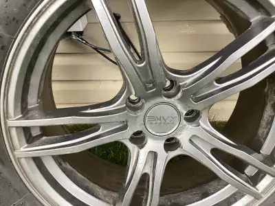 Set of four Envy rims with bf Goodrich winter tires..245/60 r 18…...fits ford edge, fusion, bronco,...