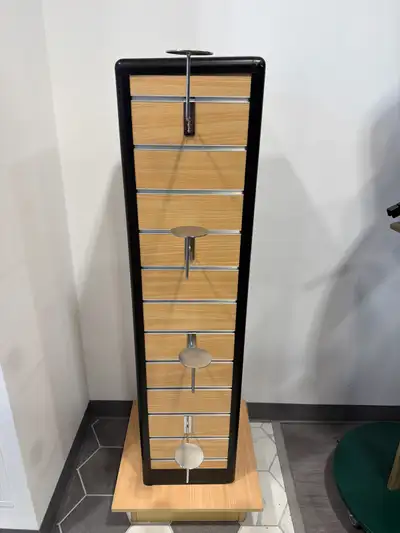 This pre-owned Slatwall Display Tower features a sturdy light wood grain finish with black trim, per...