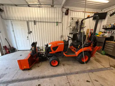 Kubota BX23S, 2020 model, for sale. This compact tractor comes loaded with a front-end loader, front...