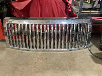 $100 for the chrome grill and $50 for the red. The red grill is cracked in a few places in the cente...