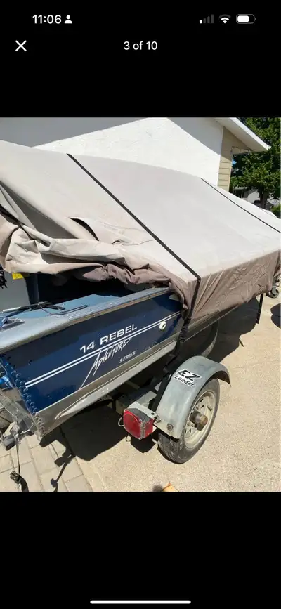 14’ Lund Rebel Adventure Series, 25HP Evinrude & EZ Loader Trailer, as well as new battery & minn ko...