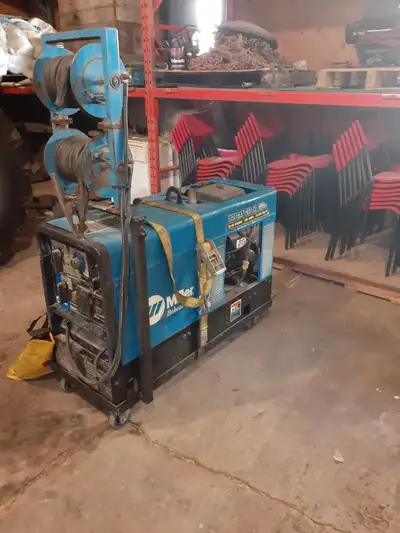 250 bobcat miller welder for sale , with reels with 50 ft of cable on each, also air arc attatchment...