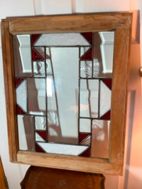 Beautiful Stained Glass Window with a Wood Frame 