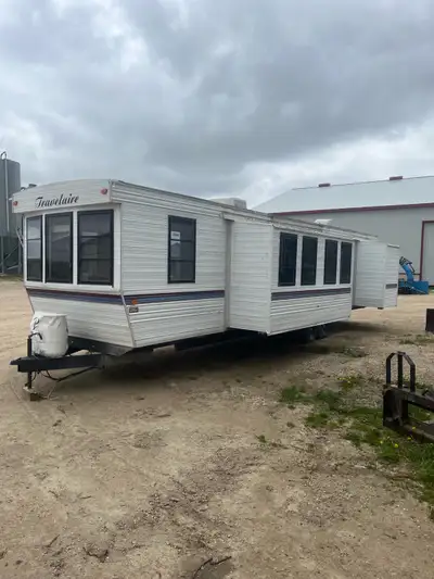 38’ park model trailer. Ready to move in. Propane tanks included. Furnace and stove and fridge and h...