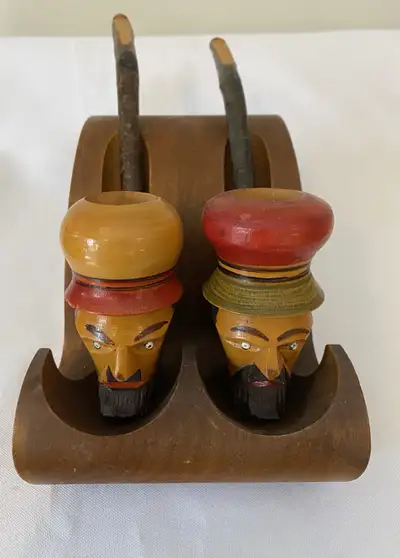 2 vintage hand carved tobacco pipes with stand., View more