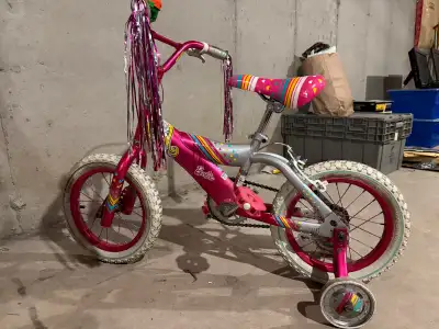 Kids Barbie bike with training wheels. Works well and in good condition. Super cute first bike! Pick...