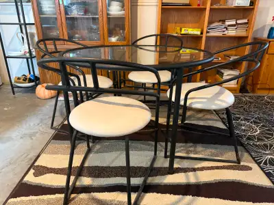 Round Glass Dining Table with Four Chairs. Condition: Good
