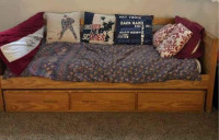 Twin captain bed and two dressers and bookcase .solid wood