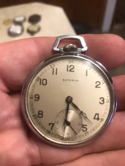 This watch is not working. It is a 15 jewel watch and Swiss made. I believe these were sold by the T...