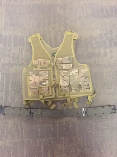 Vest is brand new never used, belt is the genuine surplus