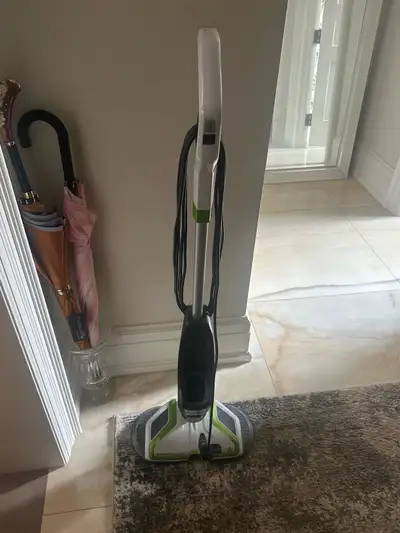 Bissell Spinwave hard floor cleaner. Has a rotating mop pad