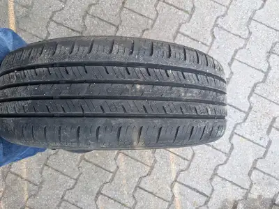 4 Tires with lots of tread. VW rims in good shape $450.00 obo. .