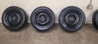 235 55 R18 VW oem steel rims with winter tires for sale.