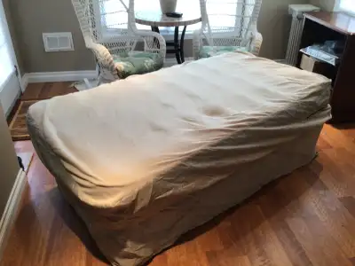 Folding camp cot with mattress. Excellent condition.