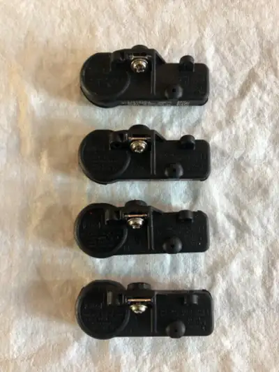 OEM TPMS sensors out of rims on a 2013 F150. Part # 9L3T-1A180-AF. Compatible with 09 - 14 F150 mode...