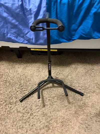 This stand is perfect for holding your electric, acoustic, or bass guitar securely on stage or in yo...