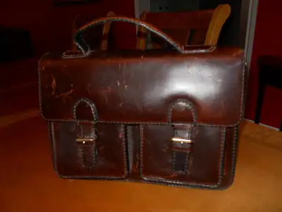 Compact Leather Briefcase in very good condition. Measures 13 inches x 9.5 inches It has 2 interior...