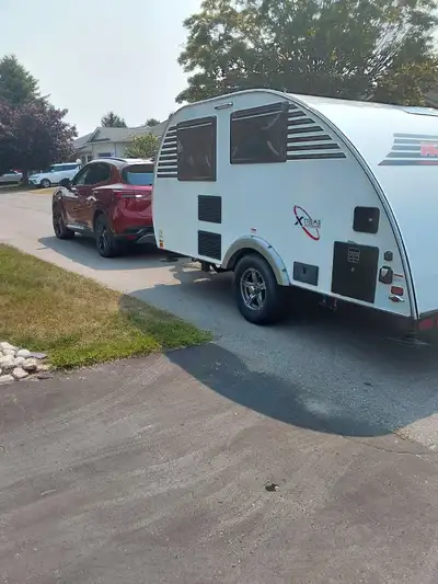 LITTLE GUY 'S TRAILER BY EXTREME OUTDOORS 15 FT. AND WEIGHS ONLY 1500LBS. EASILY TOWED BY 4 CYL BUIC...