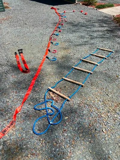 Canadian Tire Ninjaline with rope ladder for access, 7 rings, 4 rope balls, 1 bar, and rope with foo...