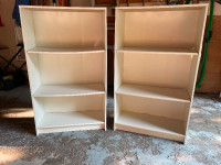 Two matching white bookcases, deep shelves