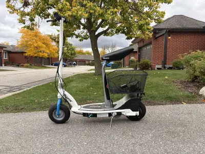 Razor Electric Scooter. Modified and detachable seating. Added storage basket. Added a second batter...