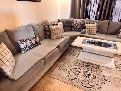 Gray sectional sofa with pillows, View more