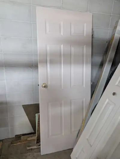 This exterior door features a classic six-panel design. 80.25" x 32" Please note that this is a used...